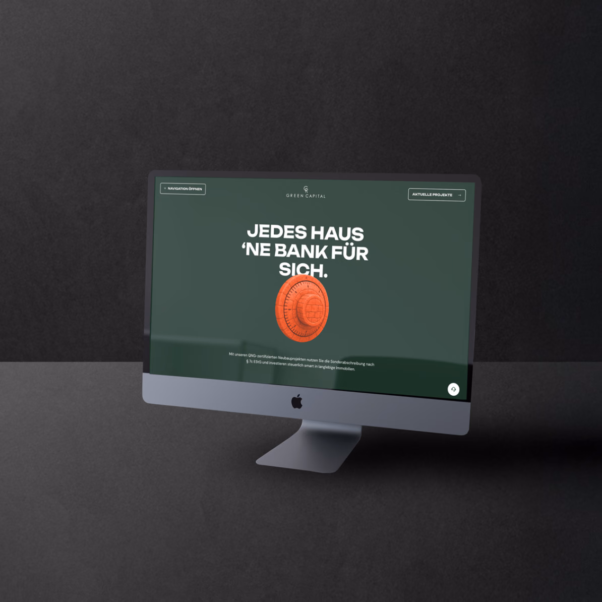 Startseite der Website von Green Capital mit Tresorrad-Grafik auf einem Desktop-Monitor